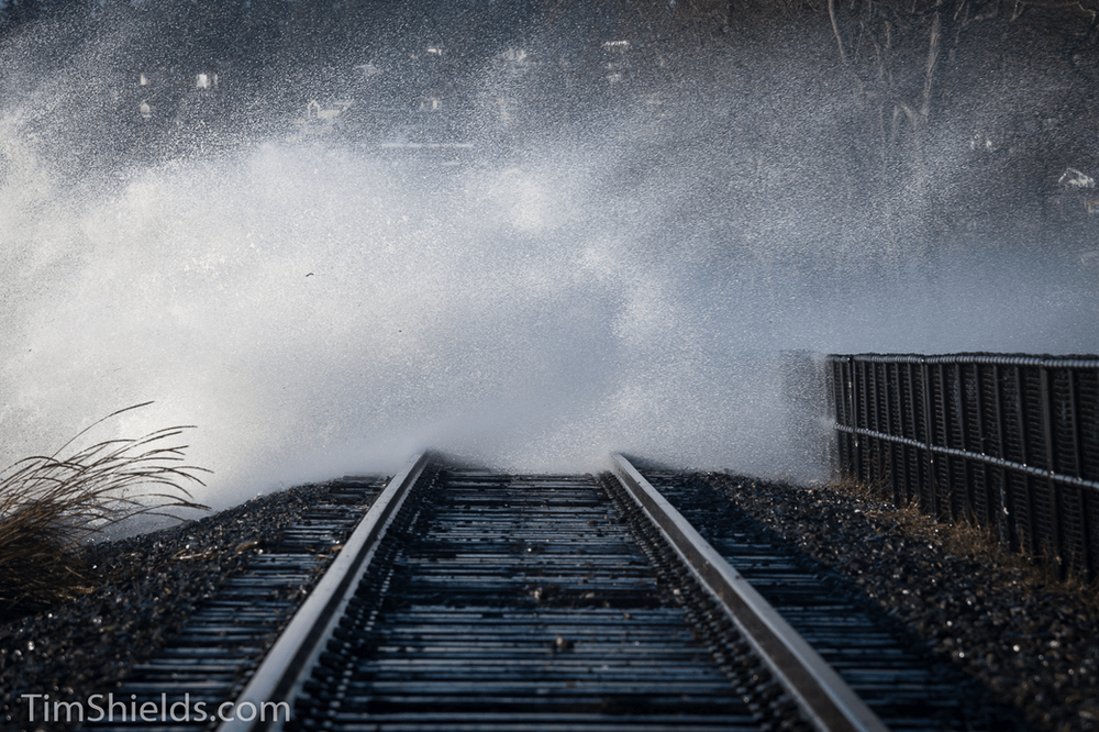 White Rock train tracks covered by waves