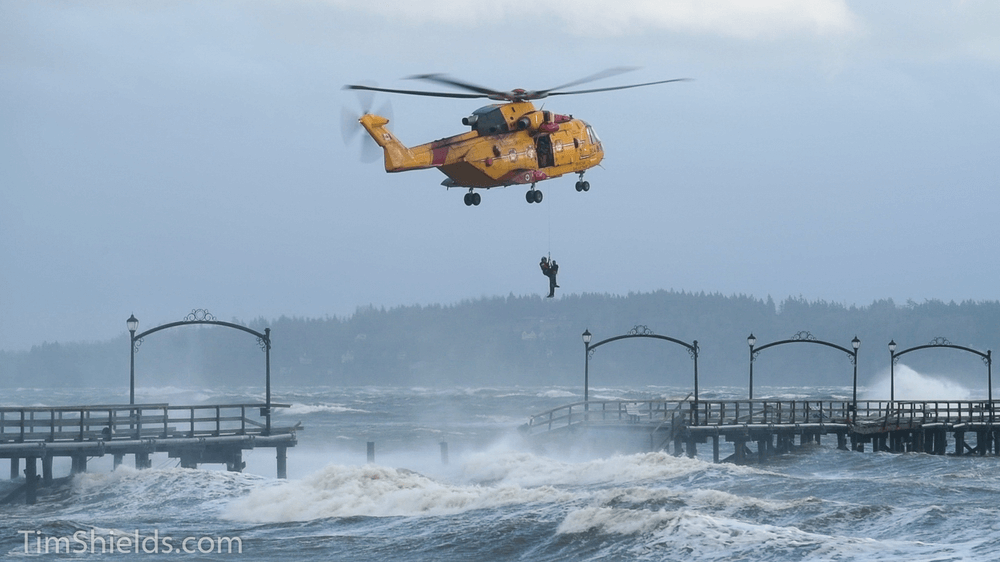 man lifted by helicopter in white rock